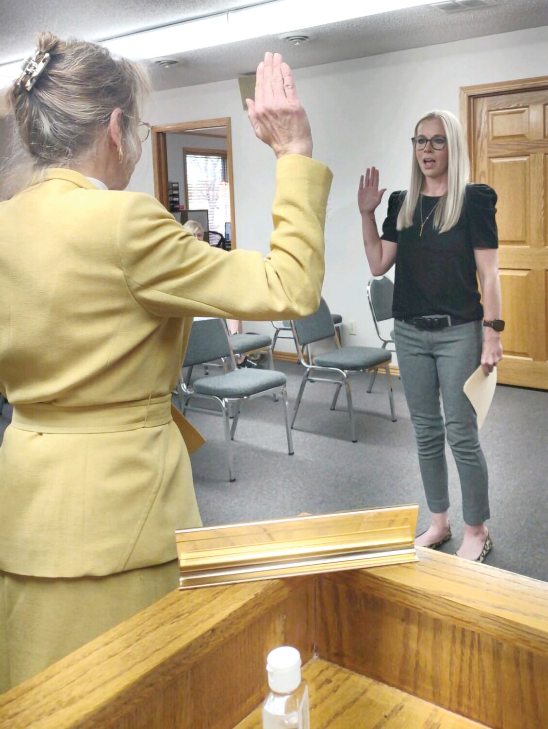 Conley issues the oath of office to newly elected mayor Amanda Moody.